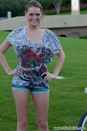 18 year old girl Katie Lewis stands naked after undressing in her bedroom